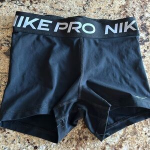 nike pros, size small